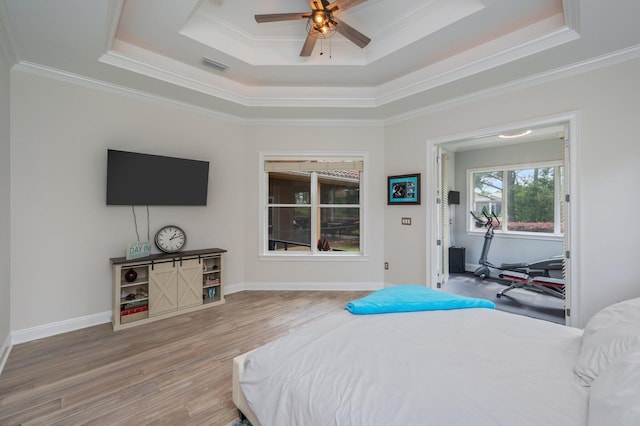 4594 Nautical Ct, Destin, FL 32541 - bedroom featuring visible vents, a raised ceiling, crown molding, and wood finished floors