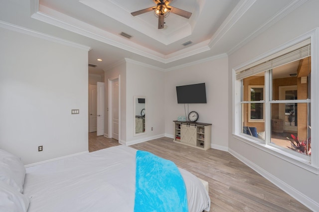4594 Nautical Ct, Destin, FL 32541 - bedroom with visible vents, ornamental molding, wood finished floors, and a tray ceiling