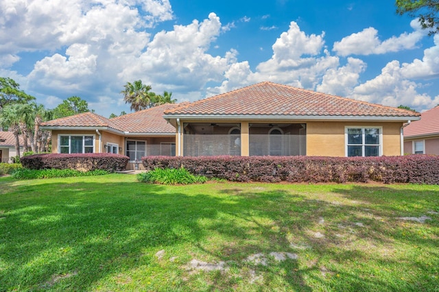 4594 Nautical Ct, Destin, FL 32541 - view of front of property with a tiled roof, a ceiling fan, a front yard, and stucco siding