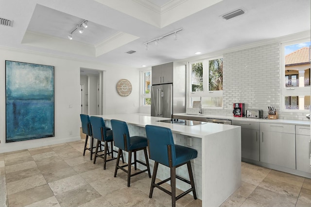 4835 Ocean Blvd, Destin, FL 32541 - kitchen featuring a center island, crown molding, track lighting, appliances with stainless steel finishes, and visible vents