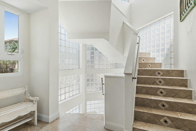 4835 Ocean Blvd, Destin, FL 32541 - staircase with baseboards and tile patterned flooring