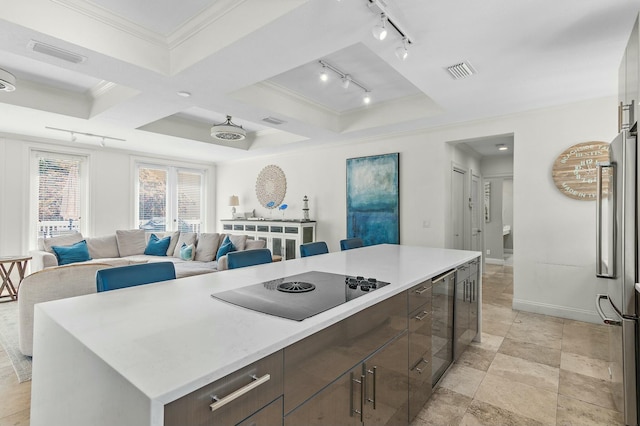 4835 Ocean Blvd, Destin, FL 32541 - kitchen featuring track lighting, black electric stovetop, visible vents, and freestanding refrigerator
