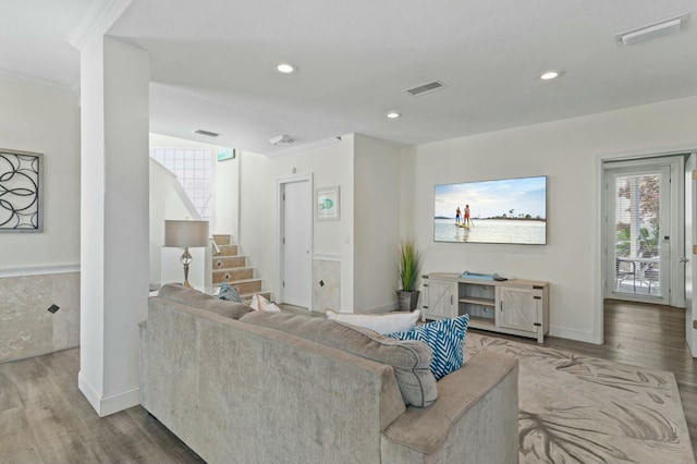 4835 Ocean Blvd, Destin, FL 32541 - living room featuring wood finished floors, visible vents, crown molding, and stairway