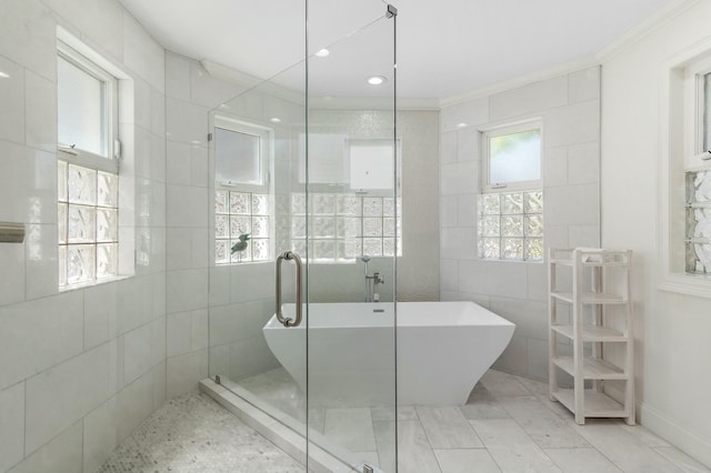 4835 Ocean Blvd, Destin, FL 32541 - full bath with tile walls, a freestanding tub, crown molding, and tiled shower