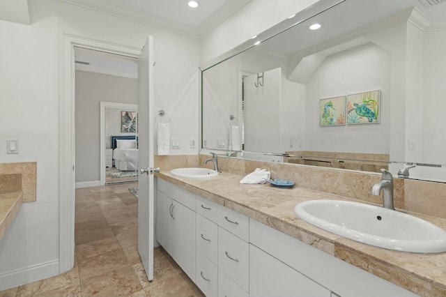 4835 Ocean Blvd, Destin, FL 32541 - ensuite bathroom with baseboards, a sink, double vanity, and crown molding