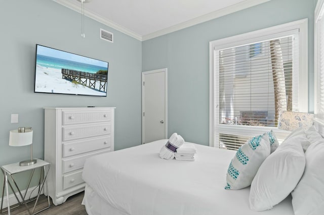 4835 Ocean Blvd, Destin, FL 32541 - bedroom with attic access, multiple windows, visible vents, and ornamental molding