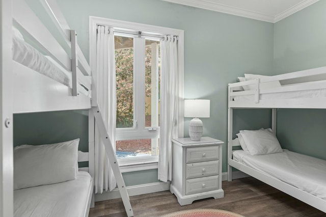 4835 Ocean Blvd, Destin, FL 32541 - bedroom featuring multiple windows, baseboards, dark wood-style floors, and ornamental molding
