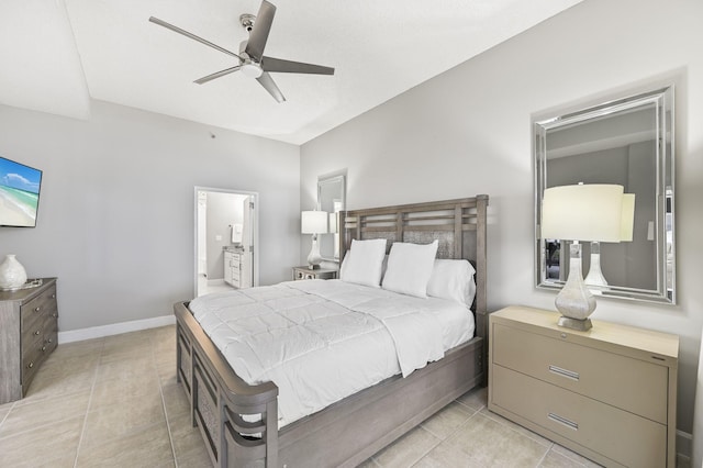 bedroom featuring ceiling fan, light tile patterned floors, baseboards, and connected bathroom