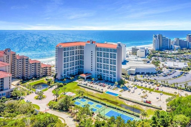 birds eye view of property with a water view and a city view