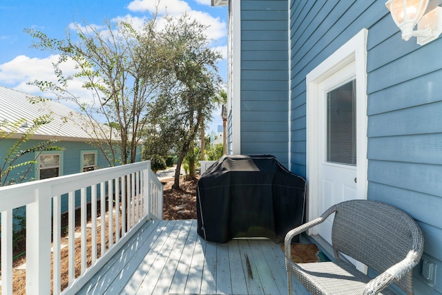 wooden deck featuring area for grilling