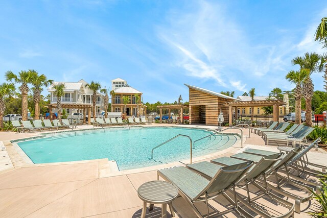 LOT35 String Lily Cv, Santa Rosa Beach, FL 32459 - community pool with a pergola, fence, and a patio