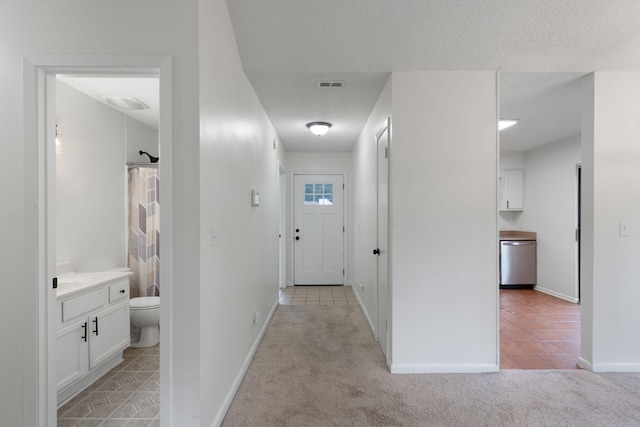 2106 Wilderness Path, Fort Walton Beach, FL 32547 - hallway featuring light carpet and light tile patterned flooring