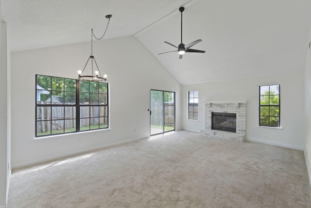 2106 Wilderness Path, Fort Walton Beach, FL 32547 - unfurnished living room with high vaulted ceiling, ceiling fan, a chandelier, healthy amount of natural light, and carpet