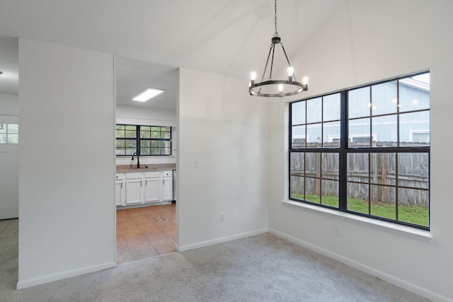 2106 Wilderness Path, Fort Walton Beach, FL 32547 - unfurnished dining area with a chandelier, light colored carpet, light tile patterned floors, and lofted ceiling