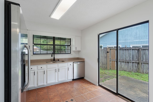 2106 Wilderness Path, Fort Walton Beach, FL 32547 - kitchen with stainless steel appliances, white cabinets, and plenty of natural light