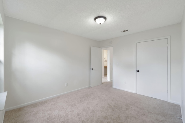 2106 Wilderness Path, Fort Walton Beach, FL 32547 - unfurnished bedroom with carpet and a textured ceiling