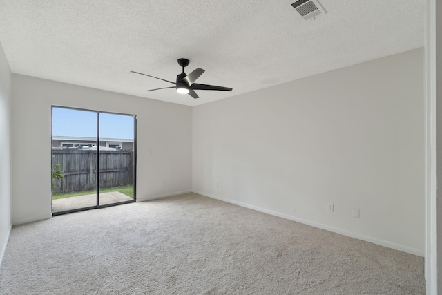 2106 Wilderness Path, Fort Walton Beach, FL 32547 - spare room featuring a textured ceiling, a ceiling fan, and carpet floors