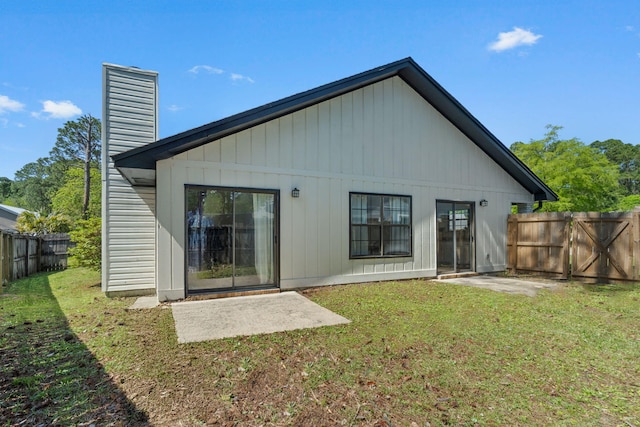 2106 Wilderness Path, Fort Walton Beach, FL 32547 - back of property featuring a chimney, a fenced backyard, and a patio