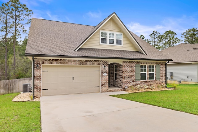 view of front of property featuring a shingled roof, a front lawn, and brick siding