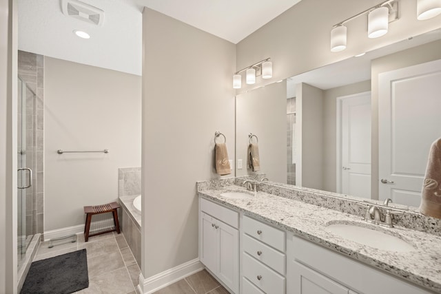 bathroom with double vanity, a bath, a sink, and a stall shower