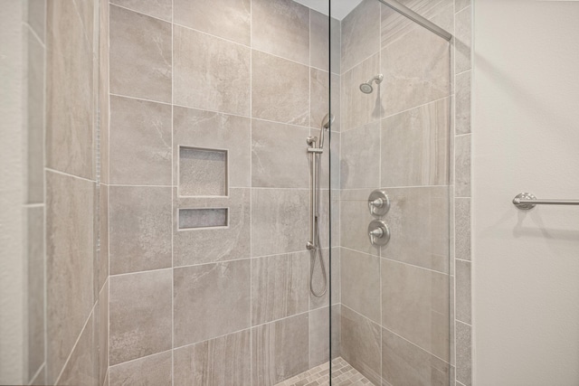 full bath featuring a shower stall