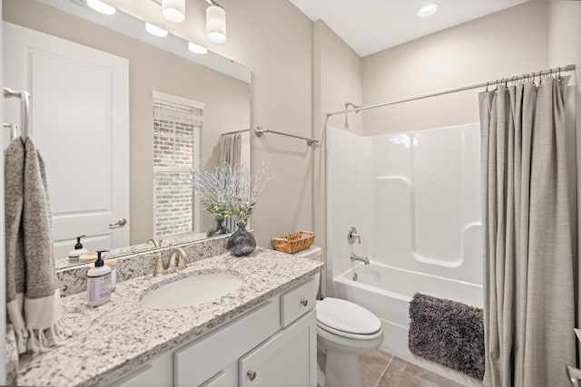 bathroom with tile patterned floors, shower / tub combo with curtain, vanity, and toilet
