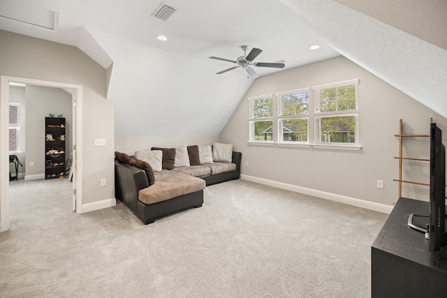living area featuring carpet floors, baseboards, visible vents, and lofted ceiling