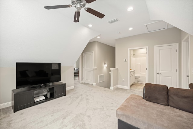 living area with baseboards, attic access, visible vents, ceiling fan, and light colored carpet