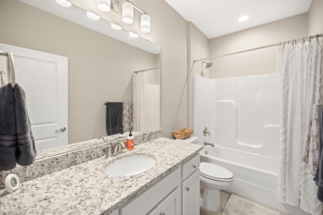bathroom with vanity, shower / bath combination with curtain, and toilet