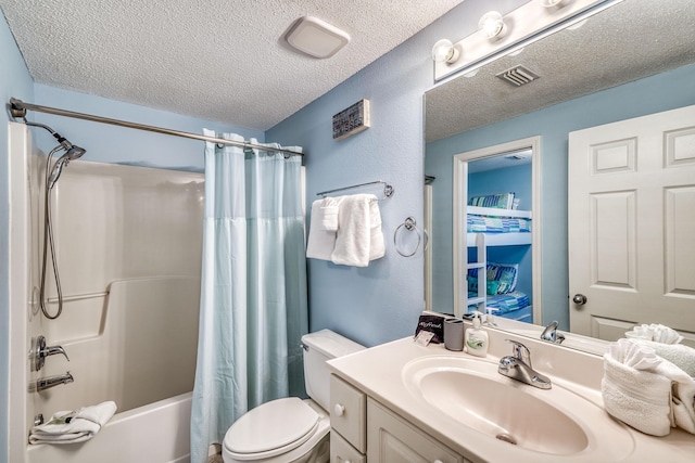 full bath with a textured ceiling, vanity, visible vents, toilet, and shower / bath combo with shower curtain