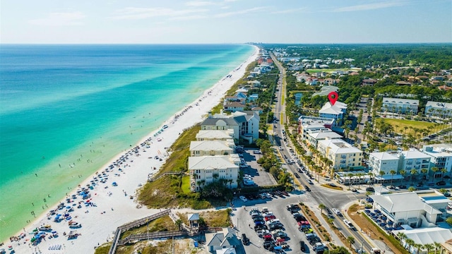 birds eye view of property with a beach view and a water view