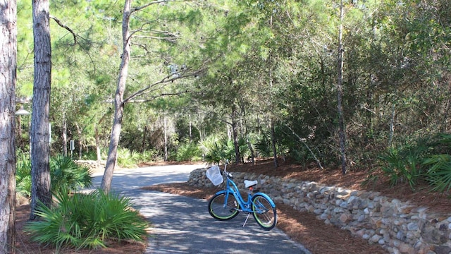 surrounding community featuring a forest view