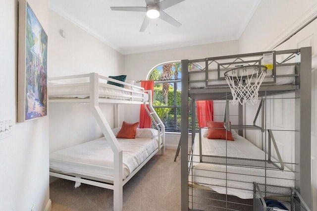 bedroom featuring ornamental molding, baseboards, and carpet