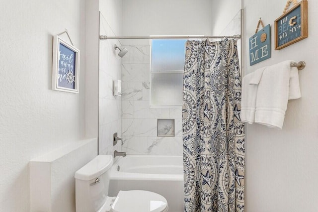 bathroom with toilet and shower / bath combination with curtain