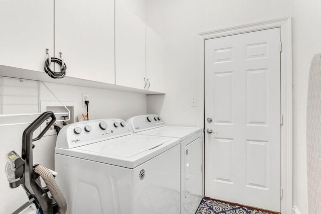 laundry area featuring cabinet space and washer and clothes dryer