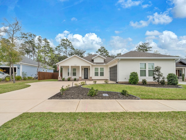 1160 Deer Moss Loop, Niceville, FL 32578 - single story home with a garage, covered porch, fence, a front lawn, and concrete driveway