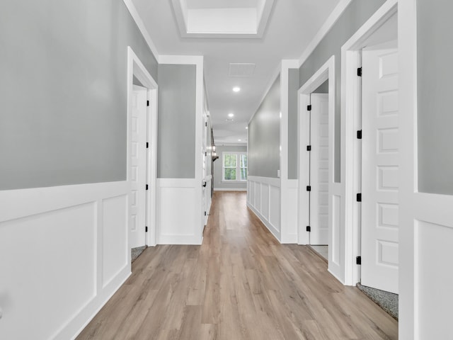 1160 Deer Moss Loop, Niceville, FL 32578 - corridor with light wood-type flooring, a decorative wall, wainscoting, and visible vents