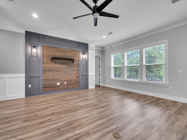 1160 Deer Moss Loop, Niceville, FL 32578 - unfurnished living room with ornamental molding, recessed lighting, light wood-style flooring, a ceiling fan, and a decorative wall