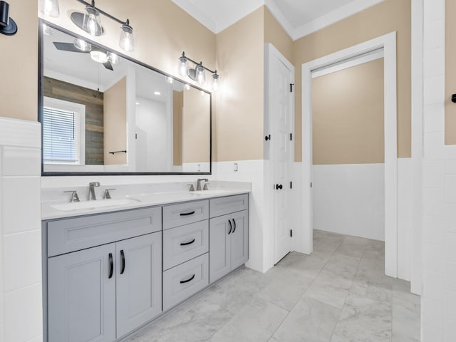1160 Deer Moss Loop, Niceville, FL 32578 - full bath featuring double vanity, marble finish floor, a sink, and wainscoting