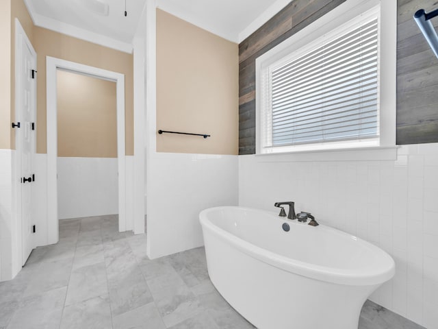 1160 Deer Moss Loop, Niceville, FL 32578 - full bath featuring a freestanding bath, marble finish floor, and tile walls