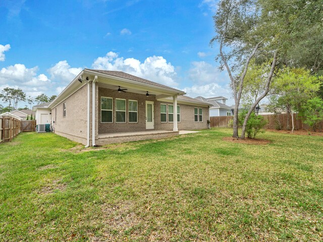 1160 Deer Moss Loop, Niceville, FL 32578 - rear view of house featuring brick siding, a fenced backyard, ceiling fan, and a lawn