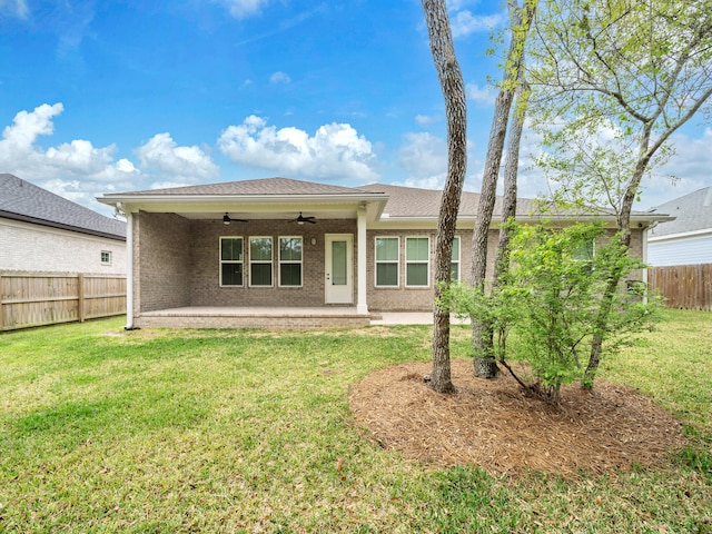 1160 Deer Moss Loop, Niceville, FL 32578 - rear view of property with fence private yard, a ceiling fan, a patio area, brick siding, and a yard