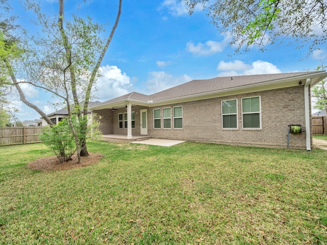 1160 Deer Moss Loop, Niceville, FL 32578 - rear view of property featuring ceiling fan, a yard, a patio area, fence, and brick siding