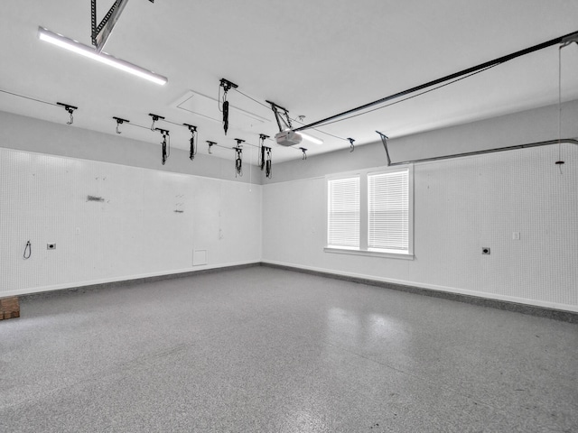 1160 Deer Moss Loop, Niceville, FL 32578 - garage featuring baseboards and a garage door opener