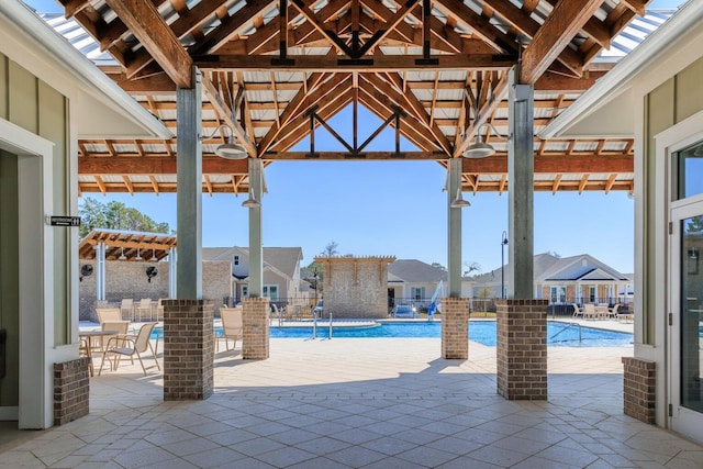 1160 Deer Moss Loop, Niceville, FL 32578 - view of patio / terrace featuring a community pool, a pergola, and a residential view