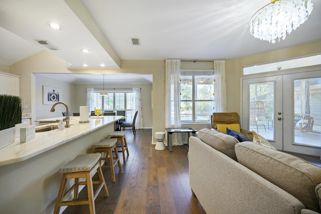 8855 Baypine Dr, Miramar Beach, FL 32550 - living area with recessed lighting, dark wood finished floors, visible vents, and french doors