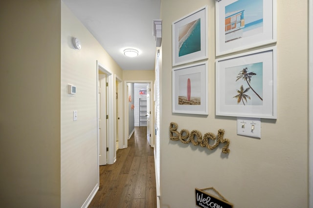 8855 Baypine Dr, Miramar Beach, FL 32550 - hallway with baseboards and dark wood-style floors