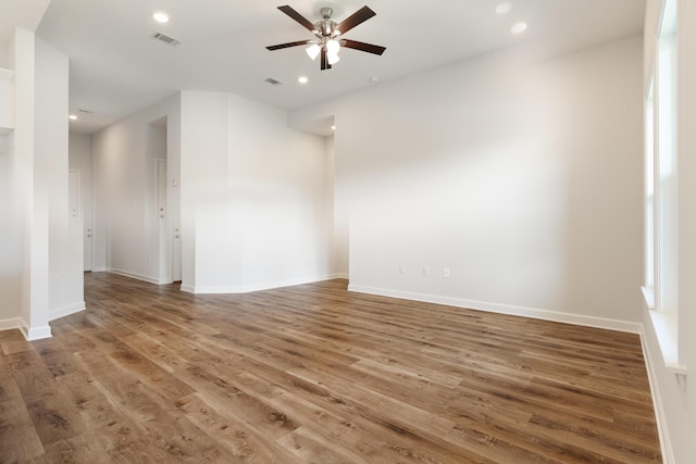6117 Tansey St, Crestview, FL 32539 - empty room with a ceiling fan, wood finished floors, recessed lighting, and baseboards