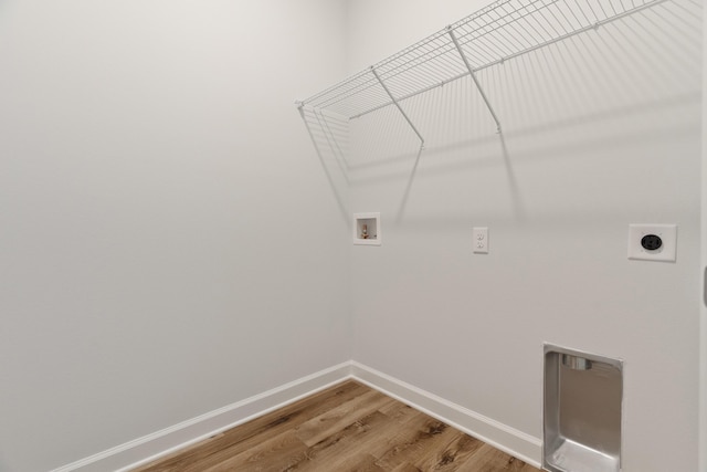 6117 Tansey St, Crestview, FL 32539 - laundry room with hookup for a washing machine, electric dryer hookup, light wood finished floors, and baseboards