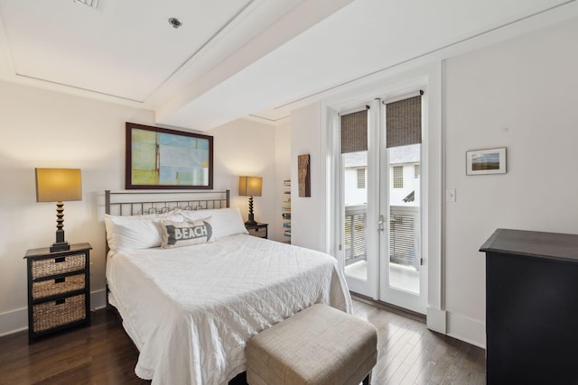 bedroom featuring access to exterior, baseboards, and dark wood finished floors